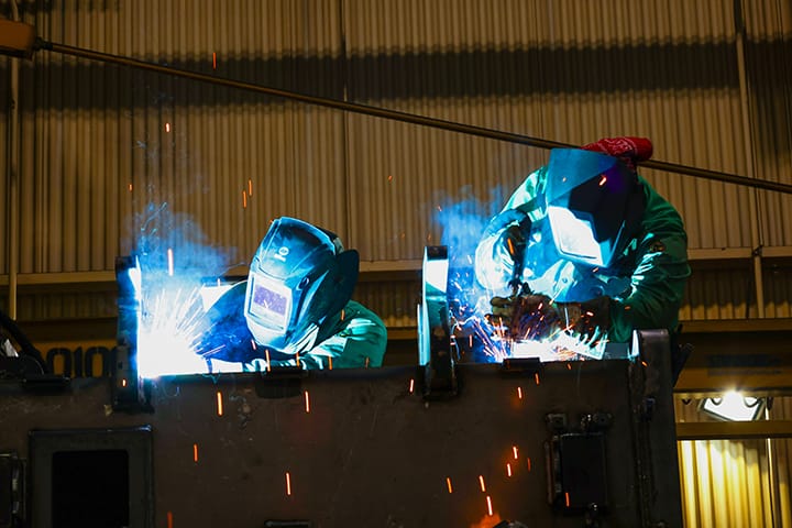 two welders working at Link-Belt Cranes